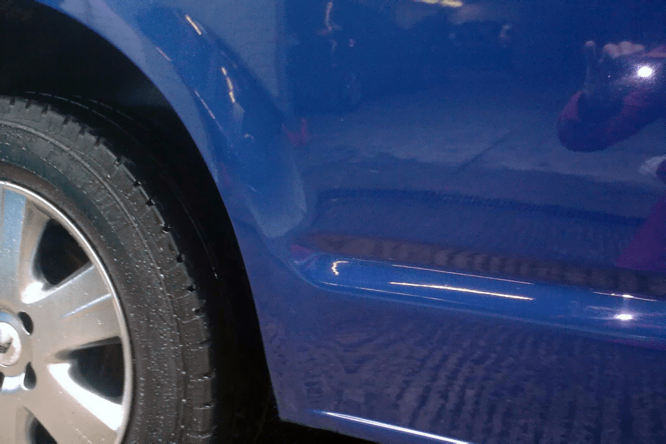 An example of how the finished job looks Photo of panel after we have repaired it